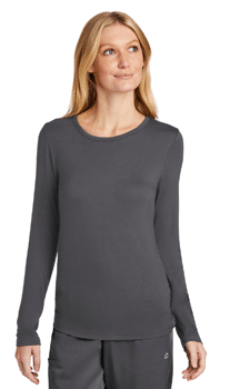 model wearing Women’s Long Sleeve Layer Tee designed to be worn under scrubs