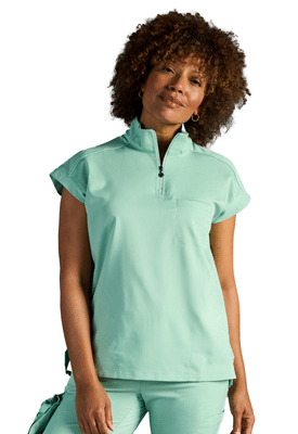model wearing mint green Healing Hands x Dr. Kwane Women’s Vienna Quarter-Zip Scrub Top