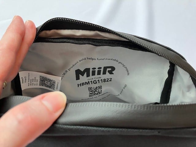 MiiR pouch interior with QR codes for Aware tracing and MiiR charitable donation