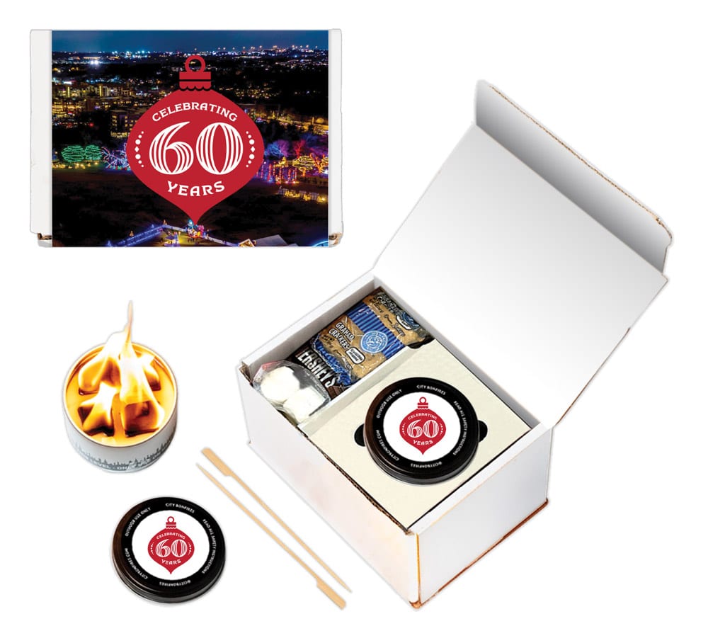 S'mores gift set in box with custom logo for Austin Trail of Lights and small lit bonfire canister