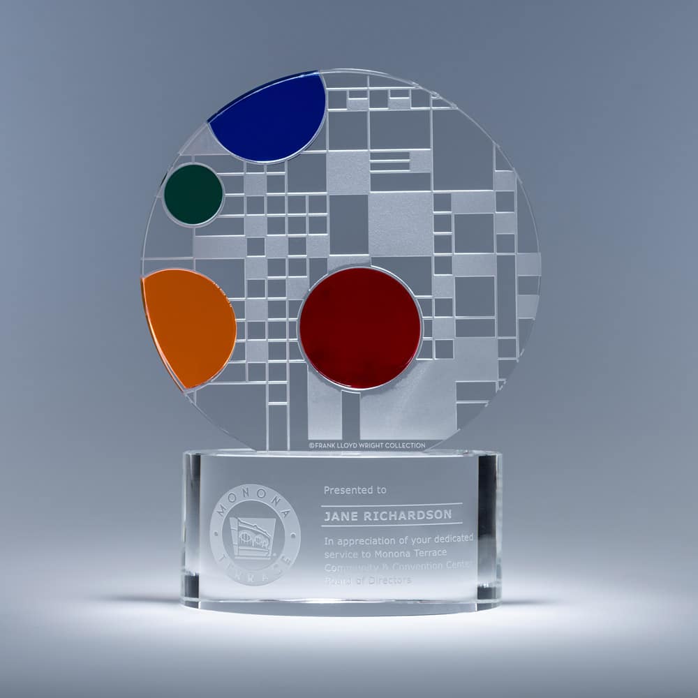 circular glass award with frosted glass grid design and colorful circles in the style of Frank Lloyd Wright