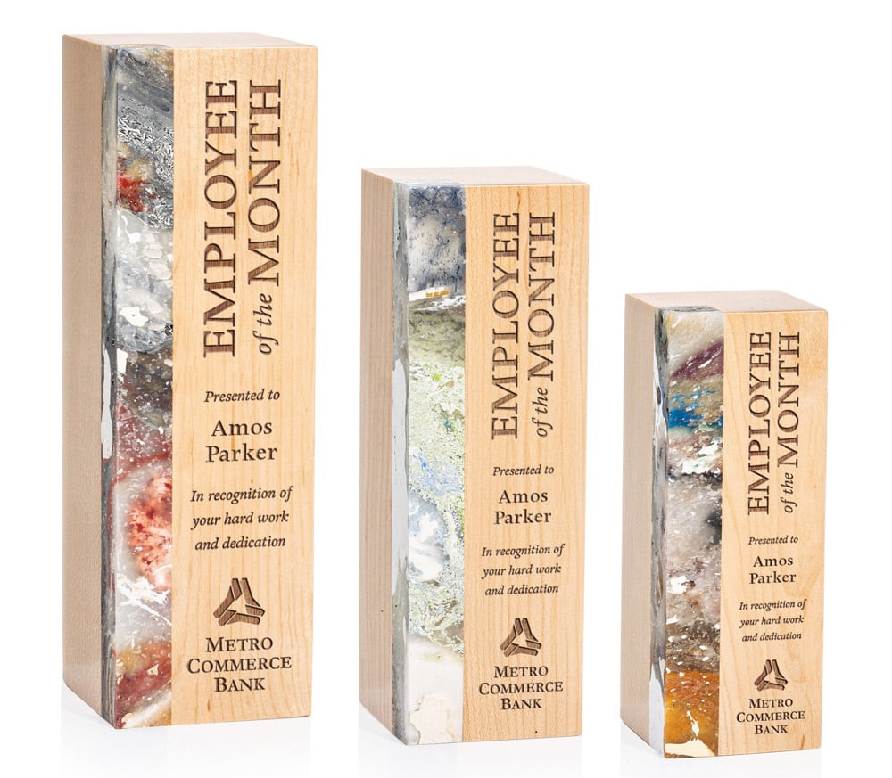 three light wood pillar awards with marbled color panel and engraving